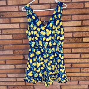 Francesca's Blue Rain Medium Blue Lemon Print Ruffle Hem Romper w/ Cutout Back